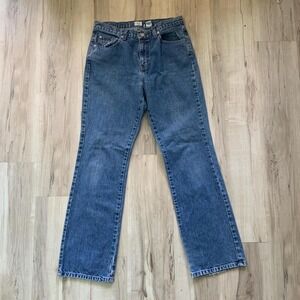 Vintage 1990s Calvin Klein blue denim jeans with a relaxed fit bootcut
